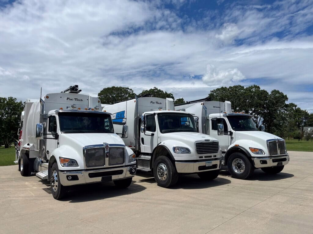 Modern waste management trucks in rental fleet